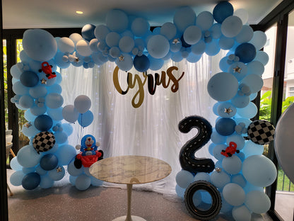 Themed white curtain backdrop with organic balloon garland and balloon sculpture by BalloonClub Singapore