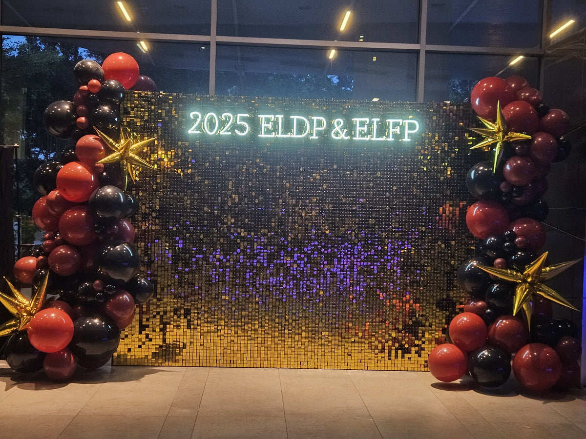 Gold shimmer backdrop 3m with red and black balloon garland for 2025 ELDP & ELFP corporate event, Singapore
