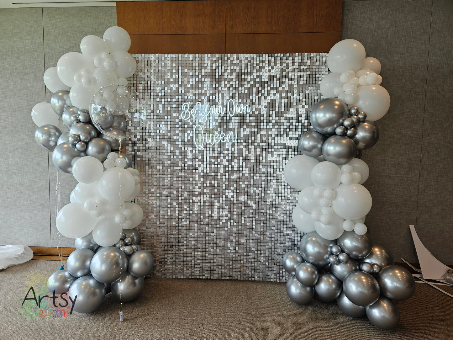 Silver Shimmer Backdrop with Organic Balloon Garland, Plinth Table, LED Signage