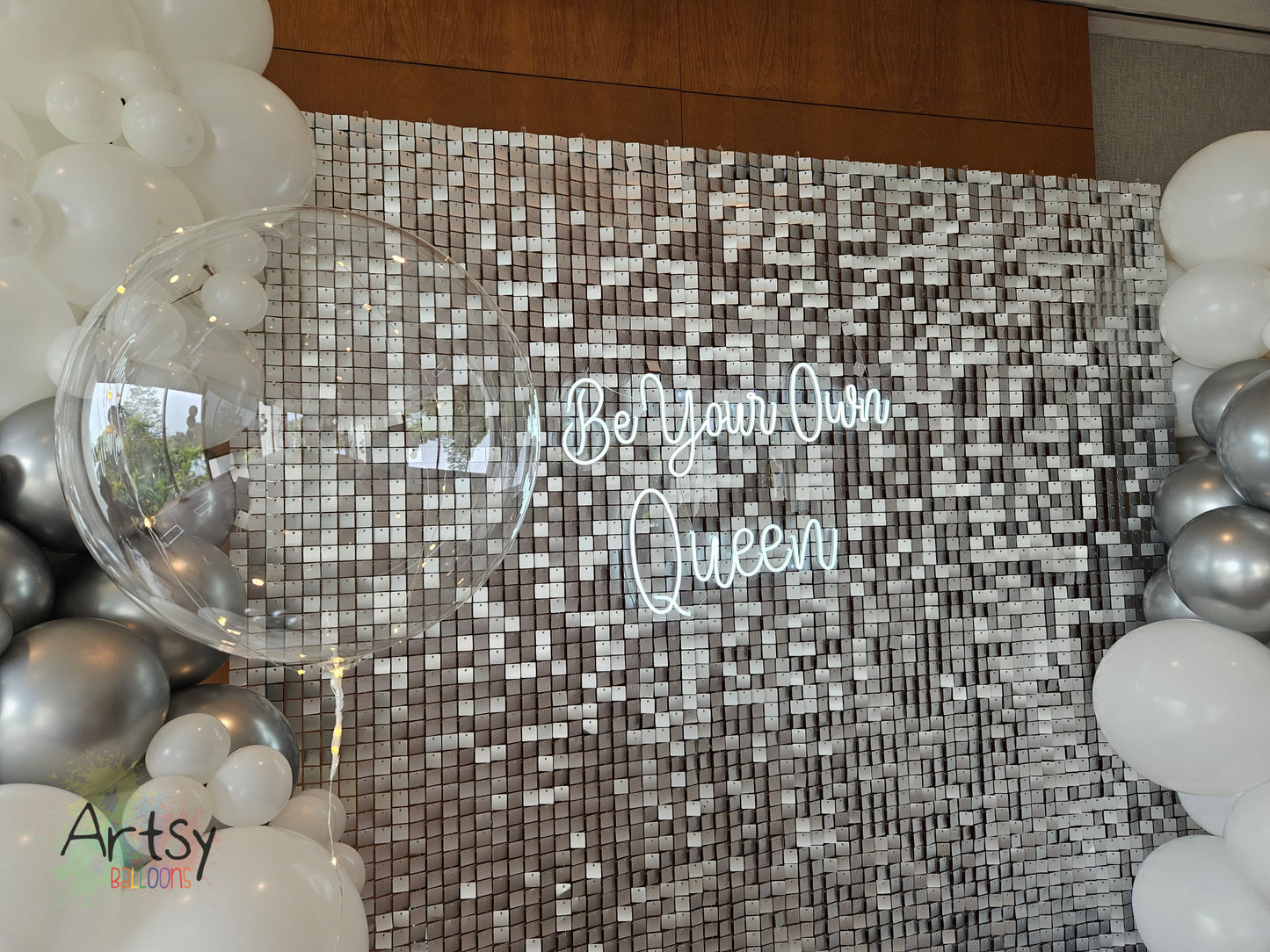 Silver Shimmer Backdrop with Organic Balloon Garland, Plinth Table, LED Signage
