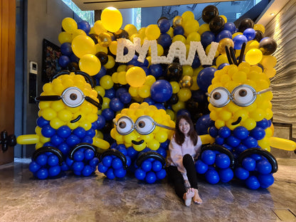 Full balloon backdrop with three large custom balloon sculptures and twisted balloon name