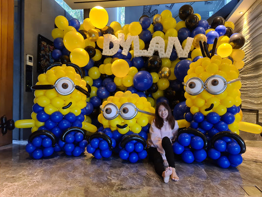 Full balloon backdrop with three large custom balloon sculptures and twisted balloon name