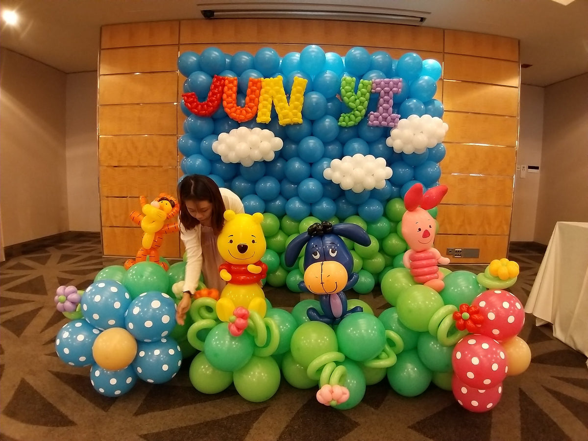 Full balloon backdrop with twisted balloon name letters and balloon characters